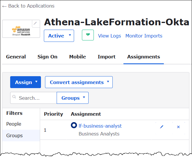 The Okta application is assigned to the Okta group.