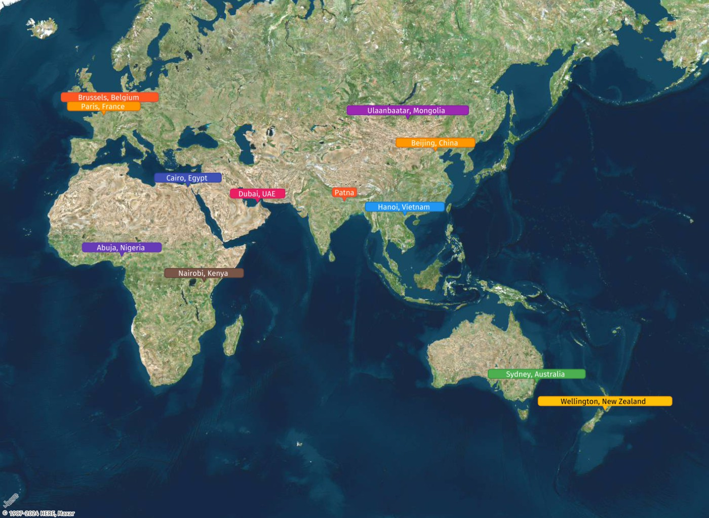 World map showing locations of major cities across continents with colored labels.